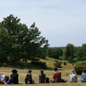 A group of Harding Scholars sitting outside at Sutton Hoo