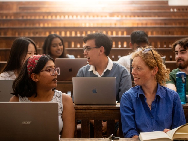 A group of students in the lecture theatre at the Student Services Centre